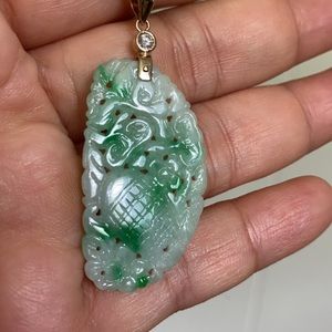Green jade with diamond pendant